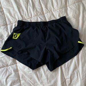 Scott running RC shorts black and neon yellow